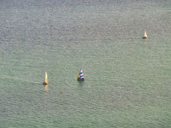 High angle view of people on boat sailing in sea