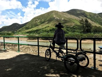 Bicycle on mountain against sky