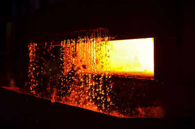 Close-up of illuminated glass window during sunset