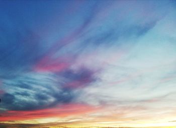 Low angle view of dramatic sky during sunset