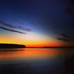 Scenic view of sea against romantic sky at sunset