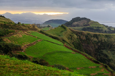 Scenic view of landscape and mountains against sky