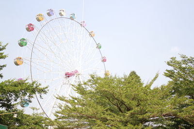 Low angle view of ferris wheel against sky