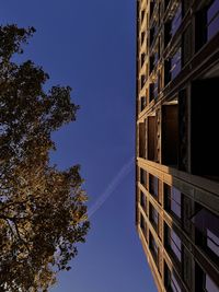 Low angle view of building against clear blue sky