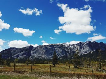 Scenic view of mountains against cloudy sky