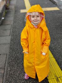 Portrait of young woman walking on street