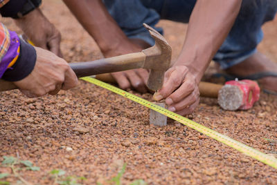 Cropped image of men working