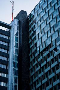 Low angle view of modern buildings against clear sky