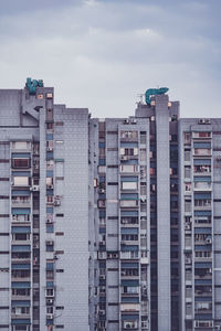 Buildings in city against sky