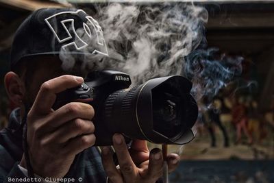 Close-up of man photographing