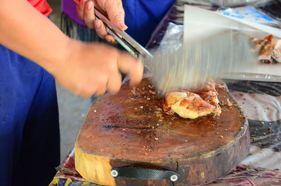 Midsection of man preparing food