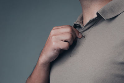 Close-up of man hand over black background