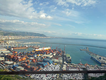 High angle view of harbor by sea against sky
