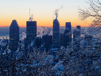 Aerial view of buildings in city during winter