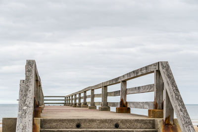 Bridge over sea against sky