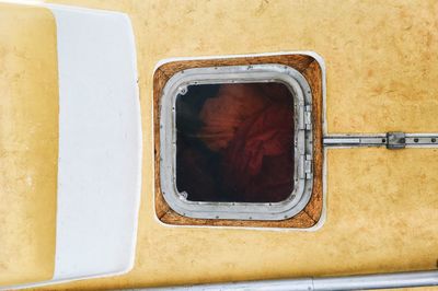 High angle view of orange window on wall