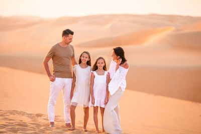 Full length of father with son standing on land