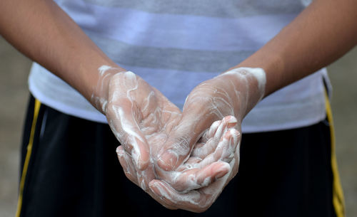 Close-up of man holding hands