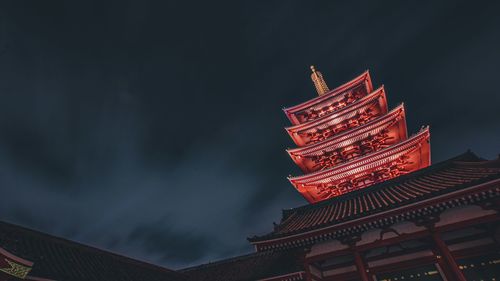 Low angle view of pagoda against sky at night