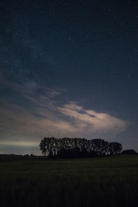 Scenic view of field against sky at night