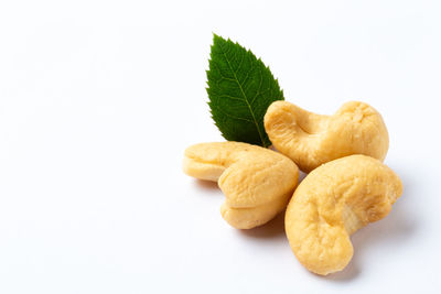 High angle view of cookies in plate against white background