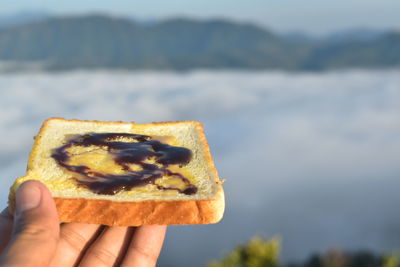 Close-up of hand holding bread