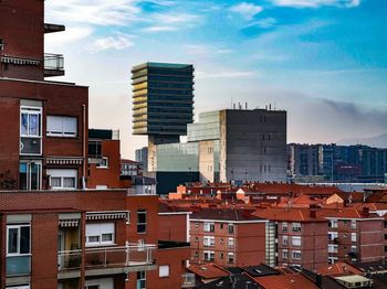 Buildings in city against sky