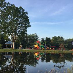 Playground at the lake with beautiful water reflection