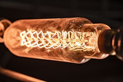 Close-up of illuminated light bulb