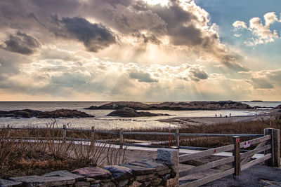 Scenic view of beach against sky during sunset