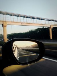 Reflection of road in side-view mirror