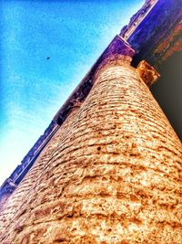 Low angle view of built structure against blue sky