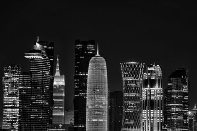 Illuminated buildings in city at night