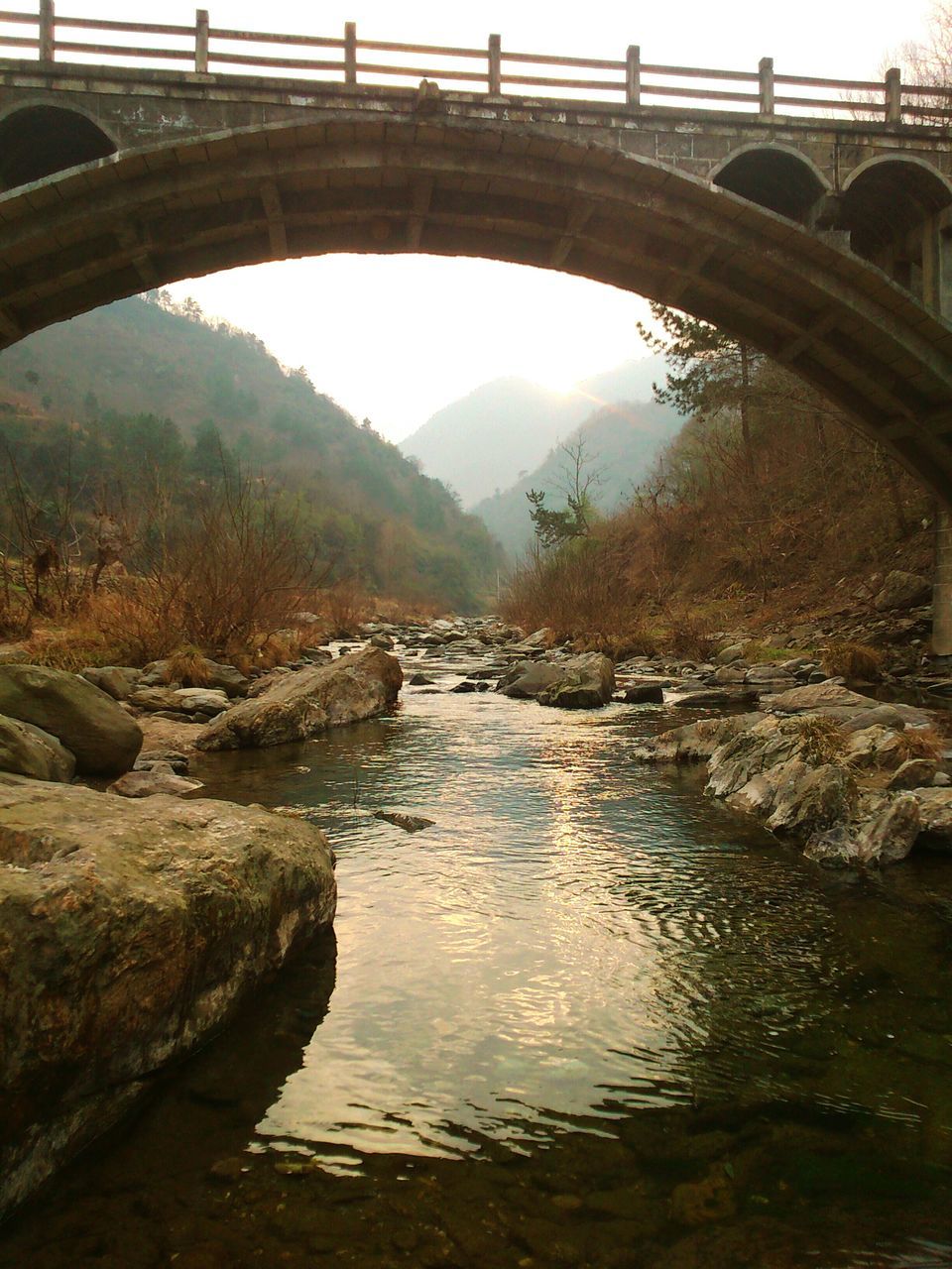 water, connection, bridge - man made structure, built structure, architecture, arch bridge, river, arch, bridge, engineering, reflection, waterfront, sky, transportation, tranquility, day, nature, no people, outdoors, travel destinations