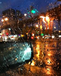 Close-up of wet glass window in rainy season