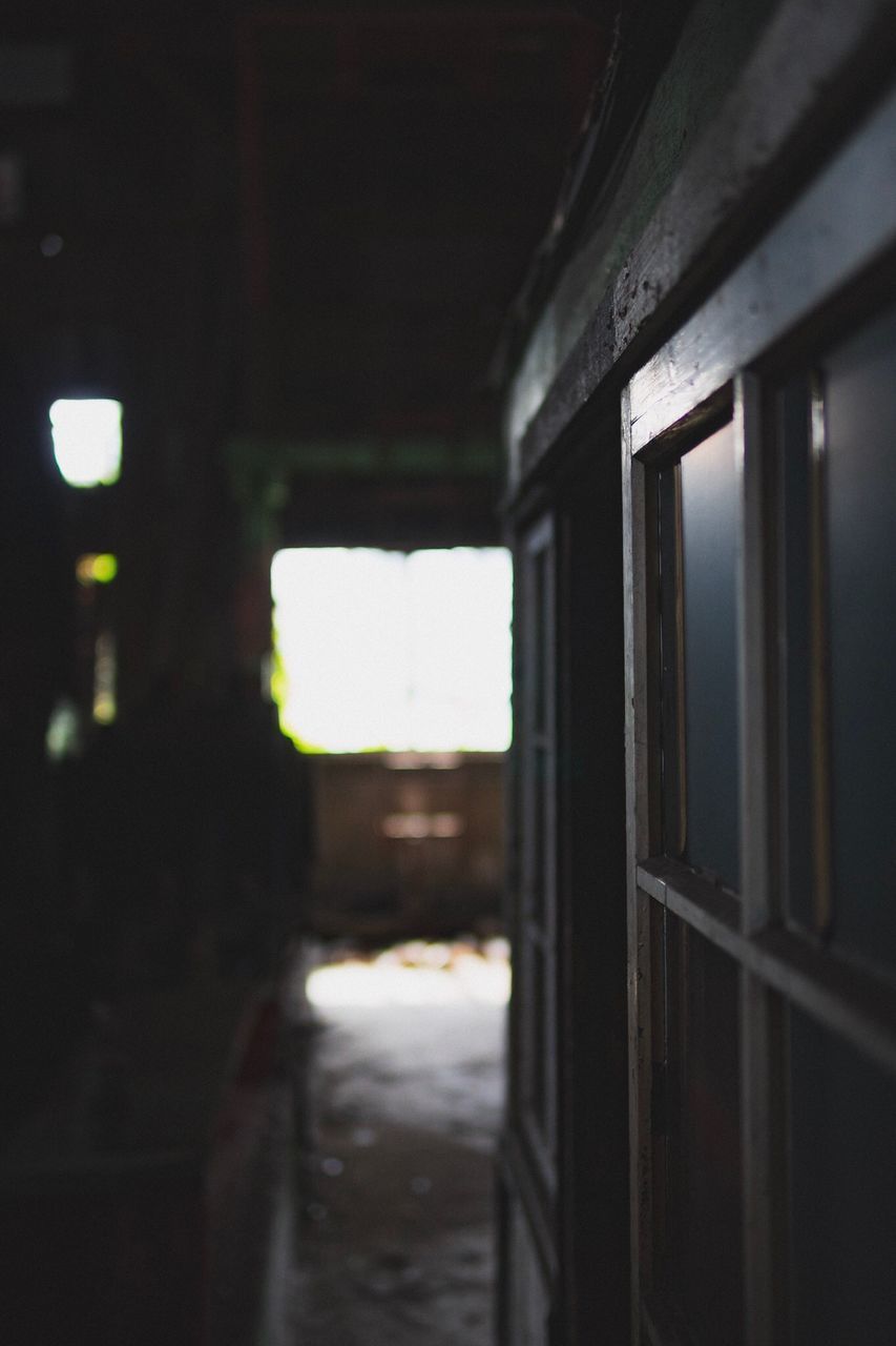 ABANDONED BUILDING SEEN THROUGH WINDOW