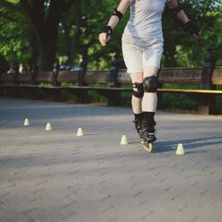 Low section of man skateboarding on skateboard