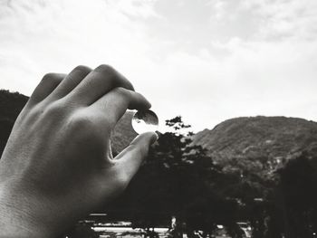 Cropped image of person holding hands