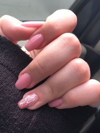 High angle view of woman hand on pink floor