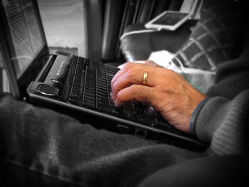 Close-up of man using mobile phone