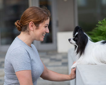 Side view of man with dog