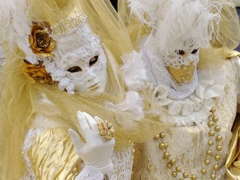 People wearing masks and costumes during carnival