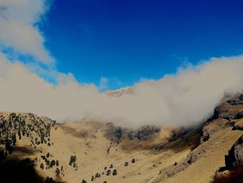 Panoramic view of arid landscape against sky