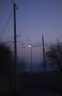 Street light against sky at night