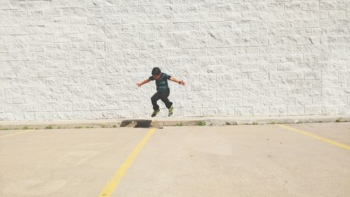 Full length of woman standing by railing