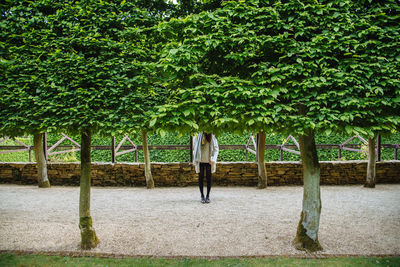 Full length of woman standing in park