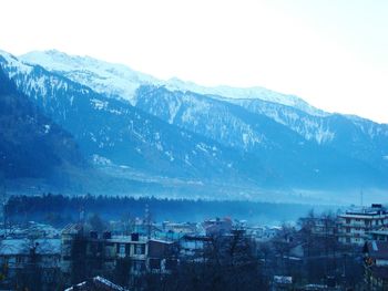 Scenic view of mountains against sky at sunset