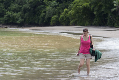 Full length of a man standing in river