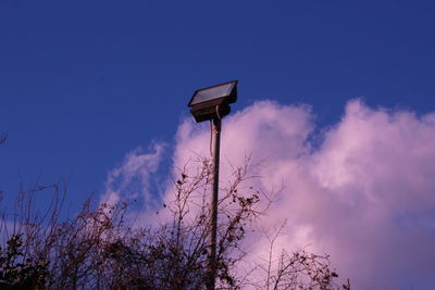 Low angle view of light pole against sky