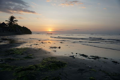 Scenic view of sea against sky at sunset